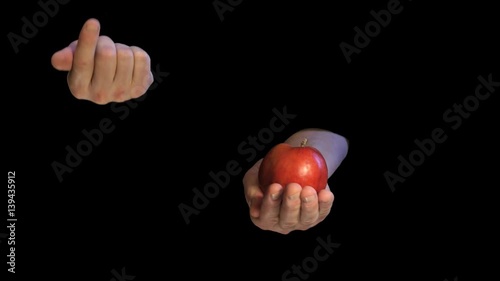 Original sin interpretation - apple and two hands on black photo