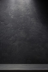 shelf and black wall on wooden