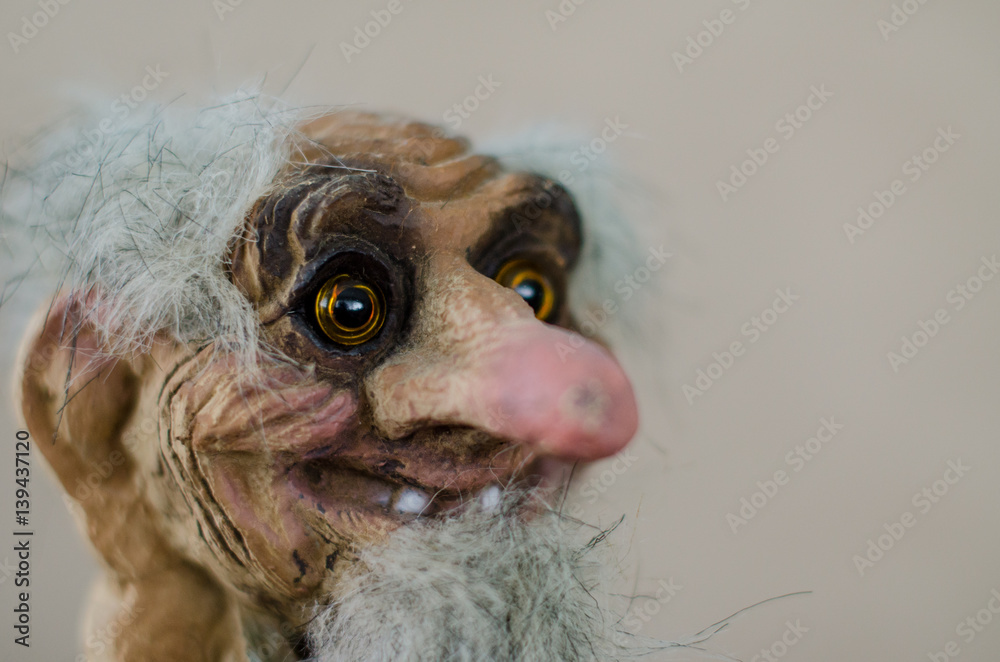 Statue of happy old man with grey hair and long nose Stock Photo