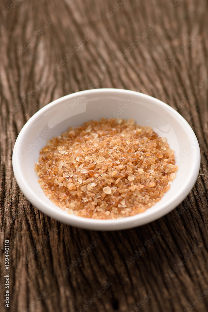 Raw Organic Cane Sugar in a white ceramic bowl Raw Organic Cane Sugar in a white ceramic bowl