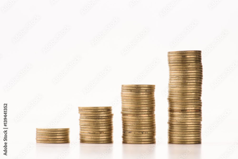 gold coins arranged as a graph on white background gold coins arranged as a graph on white background
