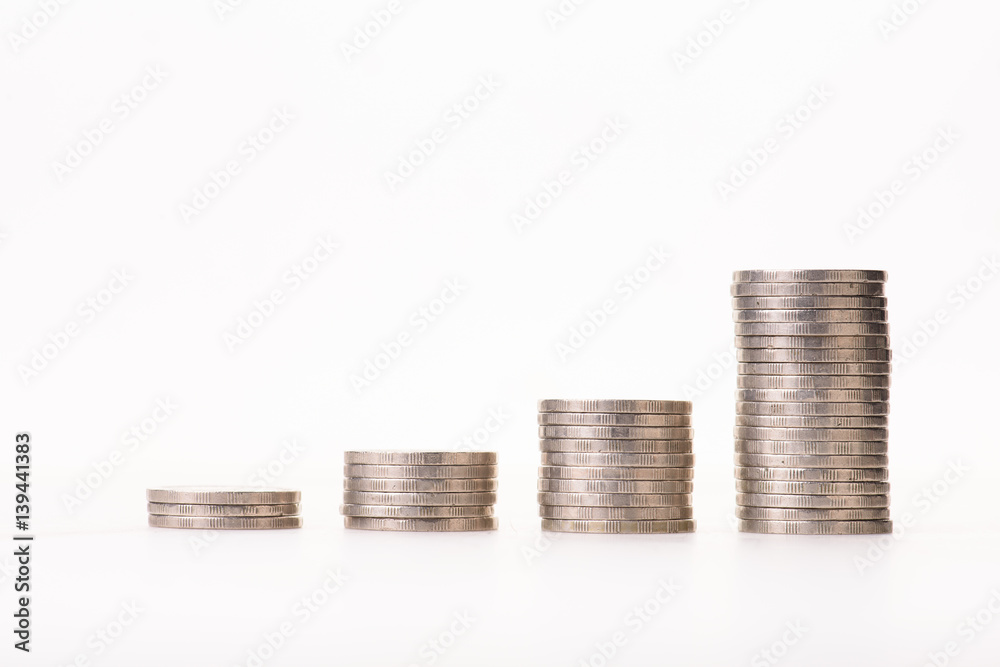 money coins arranged as a graph on white background money coins arranged as a graph on white background