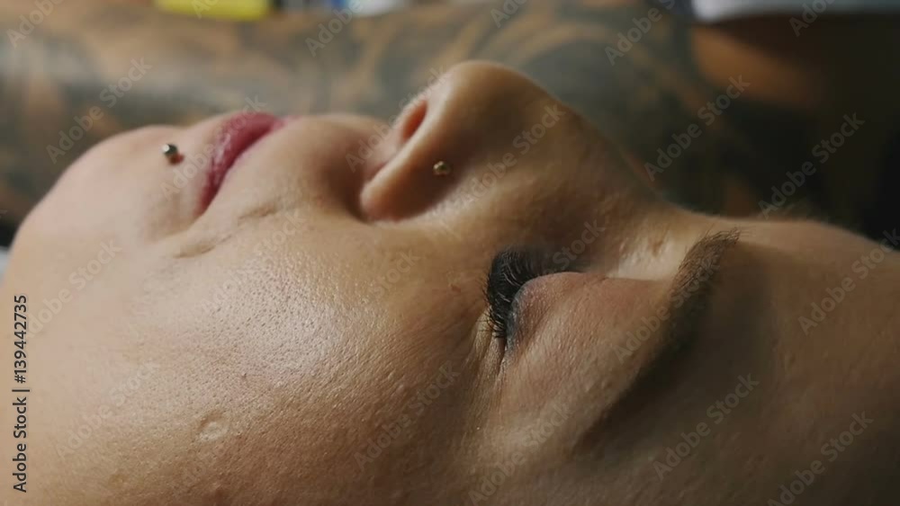 Beautiful girl lying with closed eyes close-up Beautiful girl lying with closed eyes close-up