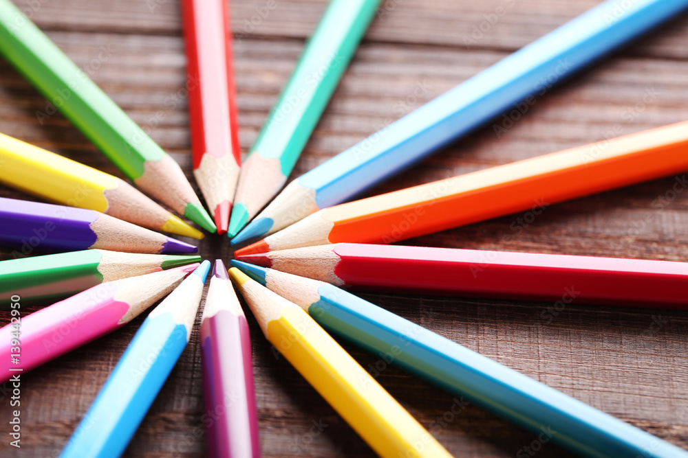 Drawing colourful pencils on brown wooden table Drawing colourful pencils on brown wooden table