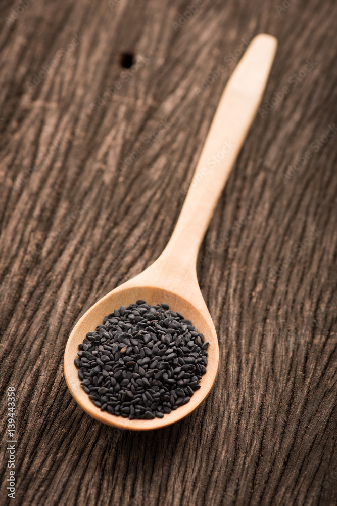 black Sesame close up shot on wood background black Sesame close up shot on wood background