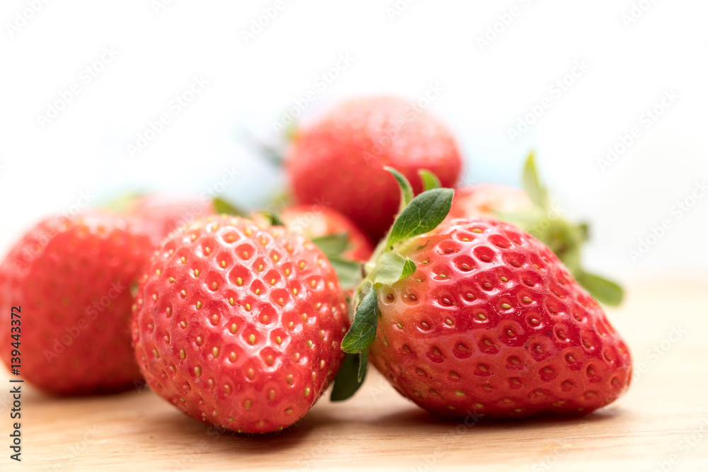 Red Strawberry on Wooden Plate Red Strawberry on Wooden Plate