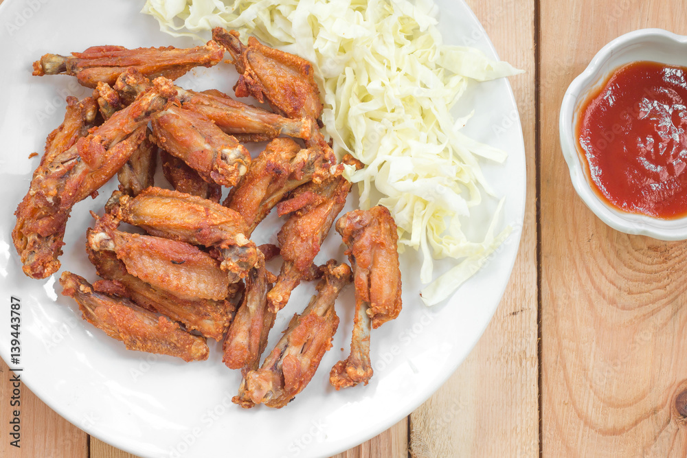 Chicken wings in plate with tomato sauce. Chicken wings in plate with tomato sauce.