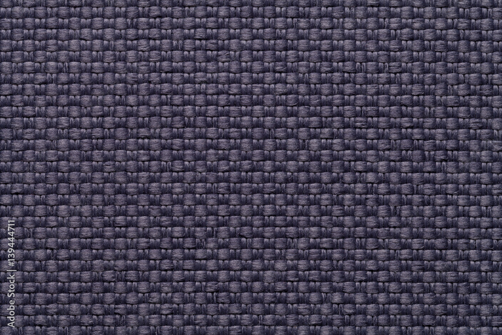Dark blue textile background with checkered pattern, closeup. Structure of the fabric macro. Dark blue textile background with checkered pattern, closeup. Structure of the fabric macro.