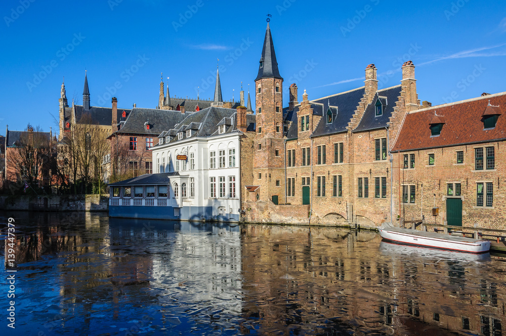 Reflection in the frozen canal in Bruges, Belgium