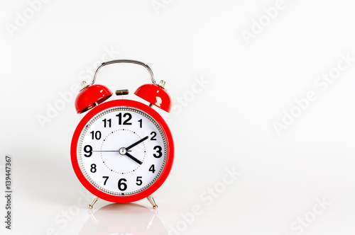 Alarm clock close up isolated on white background. Copy space for text.