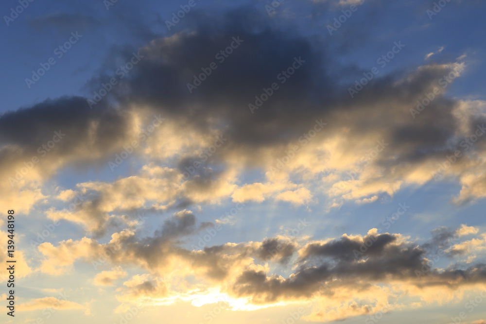 Clouds and sun beams on evening time