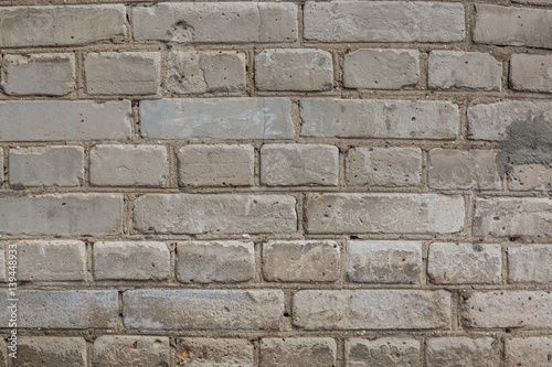 Grey brick wall with cement texture background