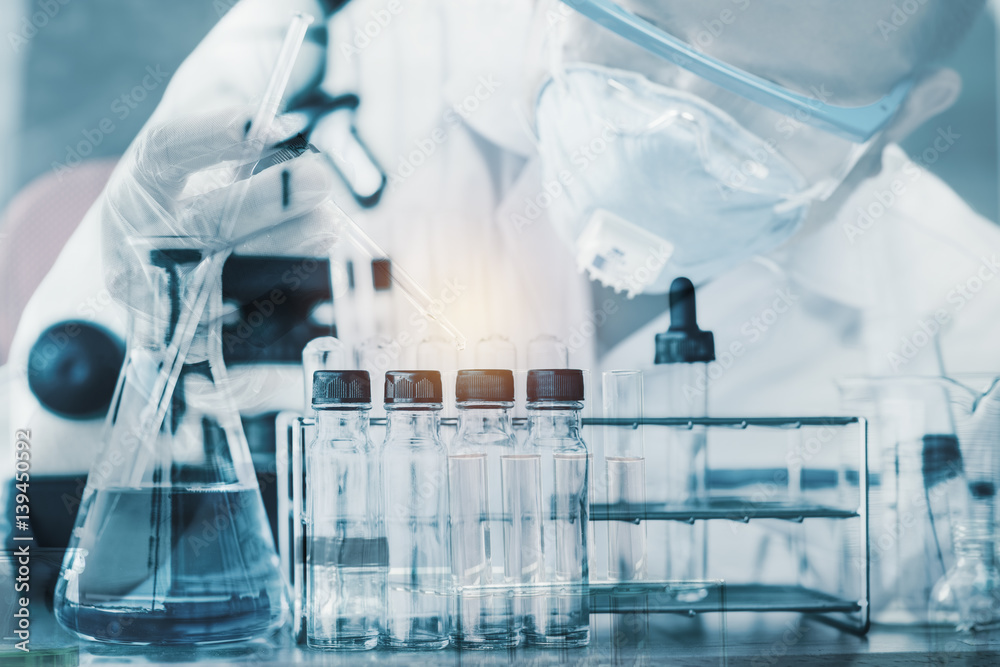 scientist with equipment and science experiments ,Laboratory glassware containing chemical liquid, science research,science background scientist with equipment and science experiments ,Laboratory glassware containing chemical liquid, science research,science background