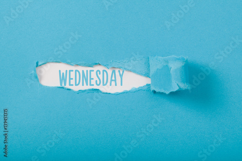 Wednesday, English weekday message on Paper torn ripped opening photo
