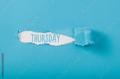 Thursday, English weekday message on Paper torn ripped opening photo