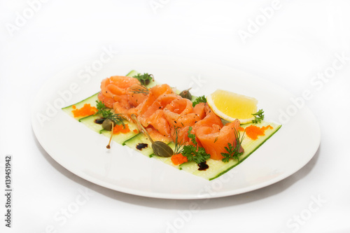 Salted salmon with lemon on white background