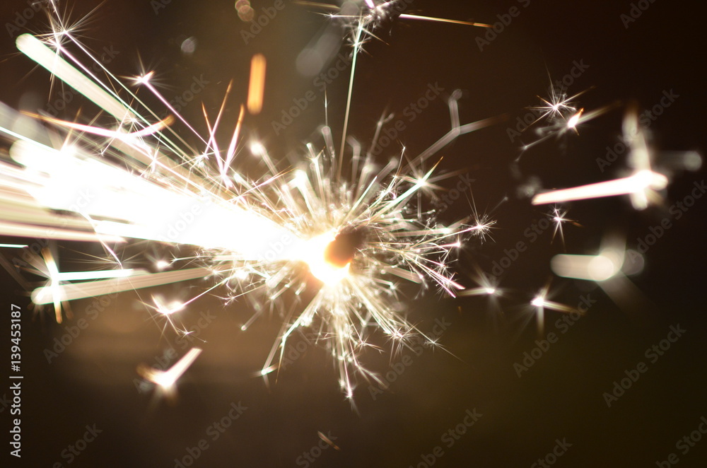 Burning sparkler isolated on black background Burning sparkler isolated on black background