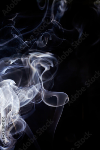 Fototapeta Naklejka Na Ścianę i Meble -  White smoke movement on black background.