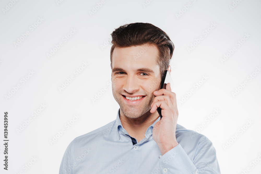 Close up portrait of Smiling Man in shirt talking phone Close up portrait of Smiling Man in shirt talking phone