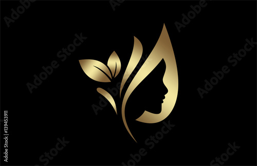 natural beauty salon and hair treatment logo in gold and metal color