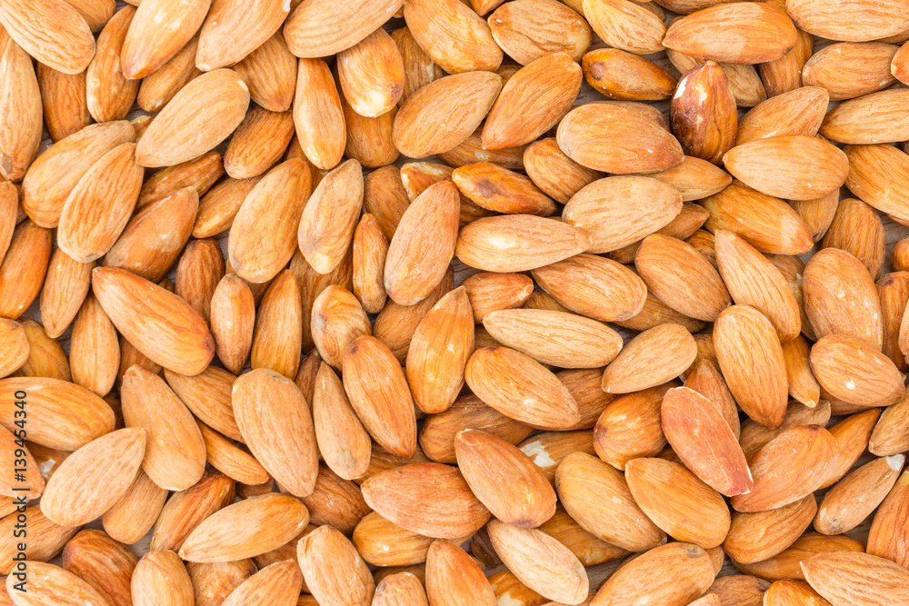 Almonds background. Peeled almonds close-up, For vegetarians. Almonds background. Peeled almonds close-up, For vegetarians.