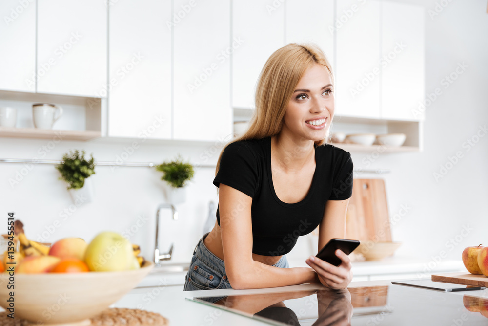 Smiling woman with smartphone Smiling woman with smartphone