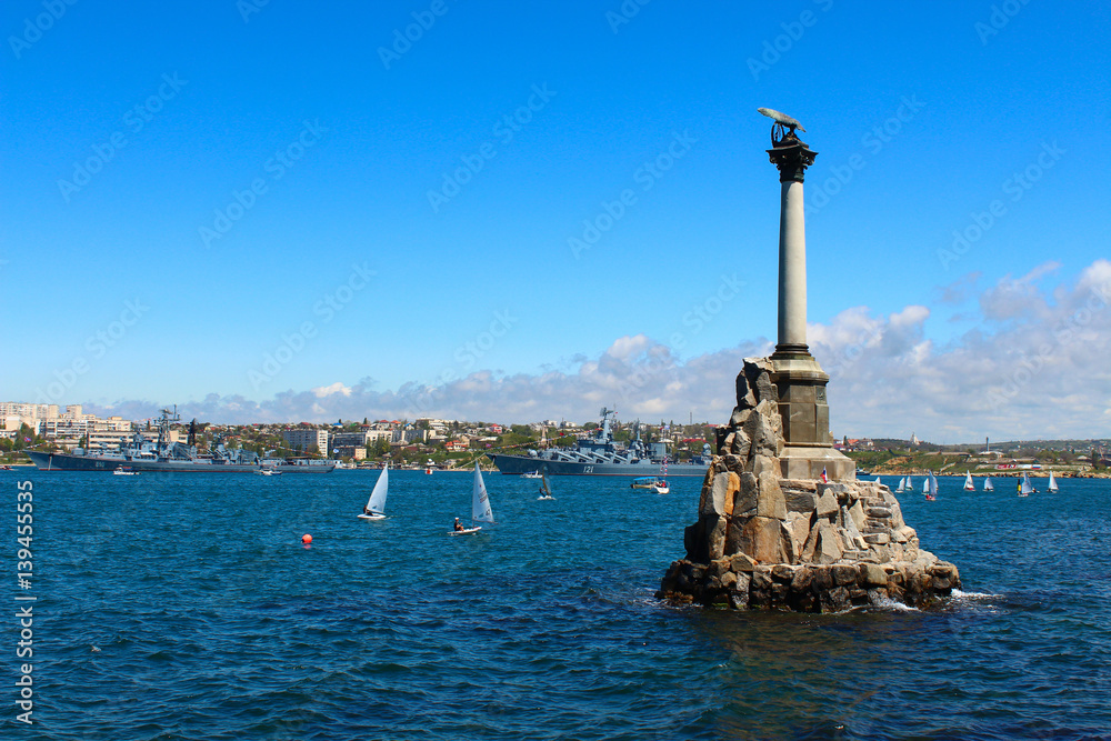 Monument to flooded ships in Sevastopol, on the background of the sea and sailing