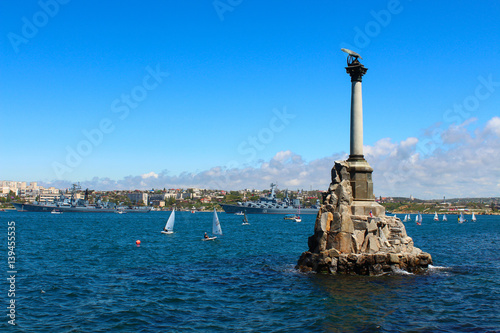 Monument to flooded ships in Sevastopol, on the background of the sea and sailing