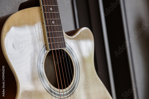 closed up guitar in soft light from window