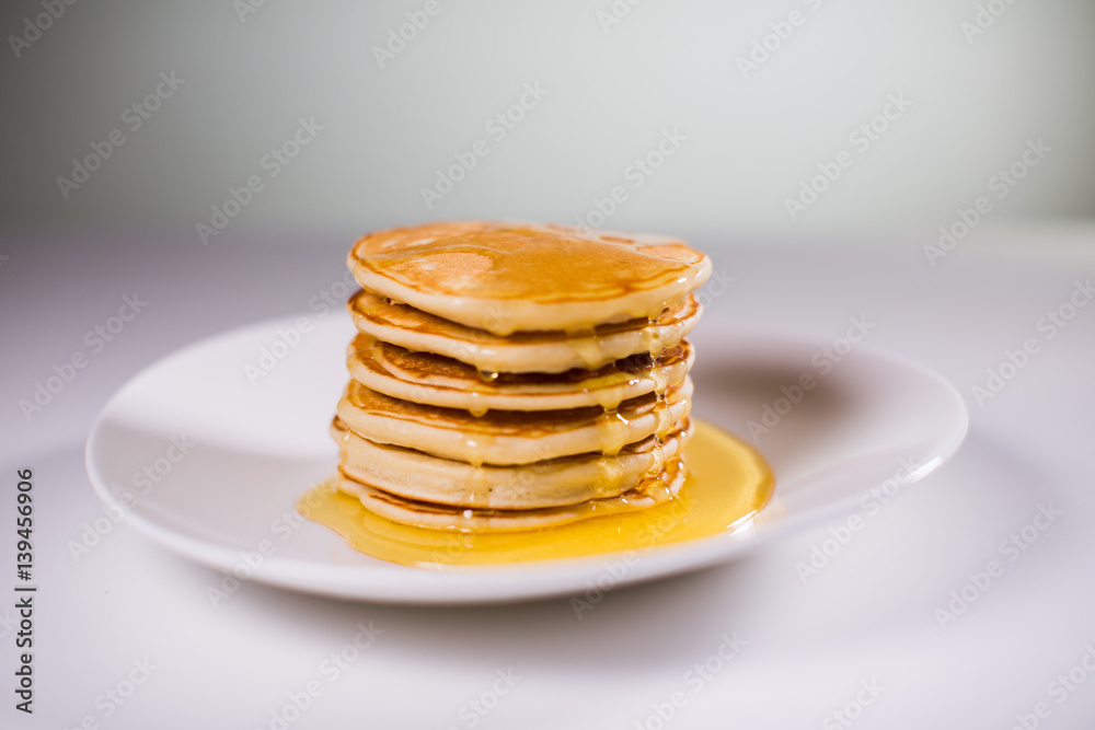 Stack of Small pancakes in syrup Stack of Small pancakes in syrup