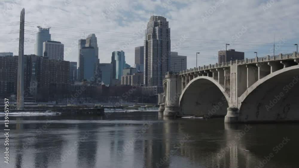 Tilt up shot of downtown Minneapolis, Minnesota from across the Mississippi River Tilt up shot of downtown Minneapolis, Minnesota from across the Mississippi River