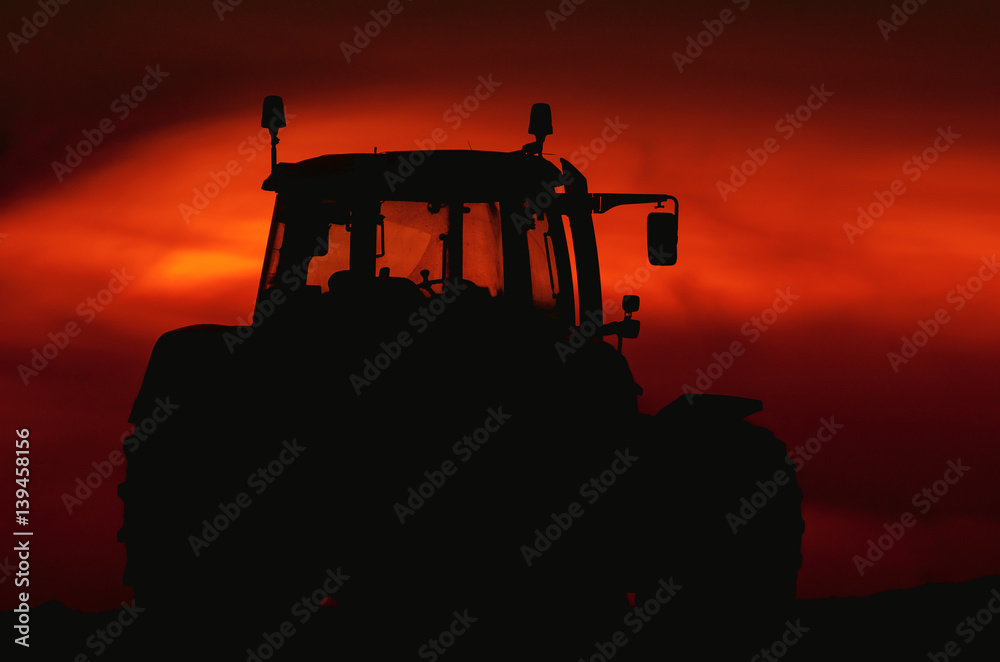 Obraz premium TRACTOR - Modern agricultural machine on the field