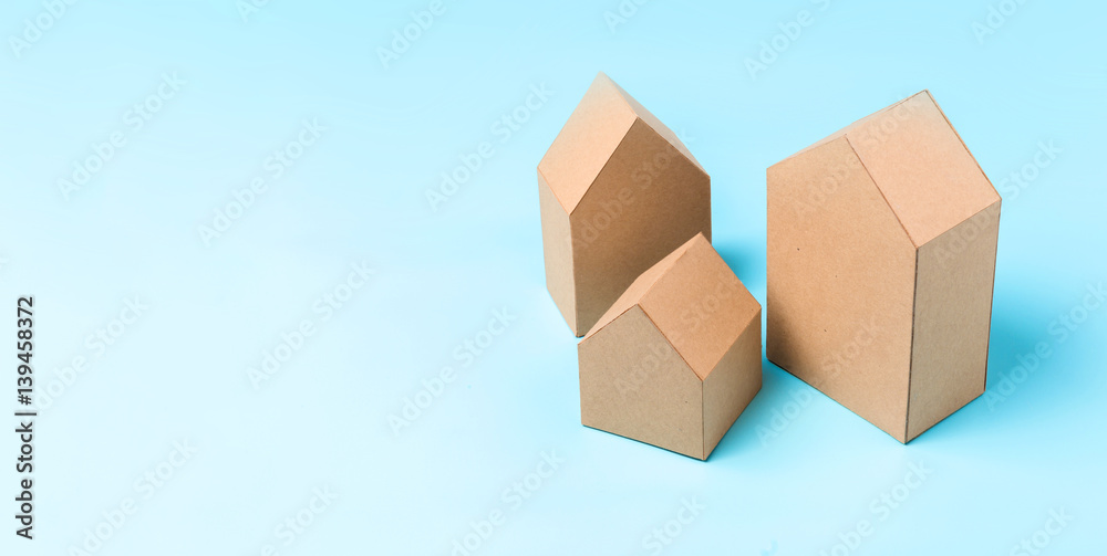 three house model cardboard with free copyspace house loan business concept