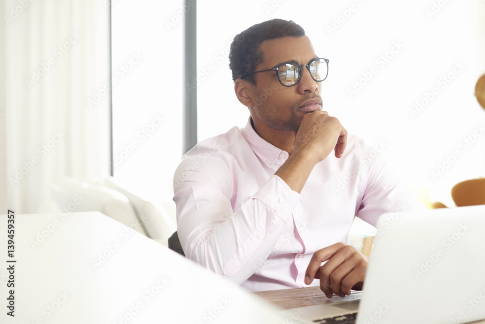 Home office is a good idea. Afro American businessman working online Home office is a good idea. Afro American businessman working online
