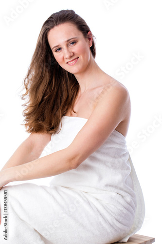 Beautiful smiling woman with cute smile in towel