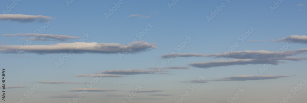 Fototapeta premium Long Slender Clouds in Evening Sky