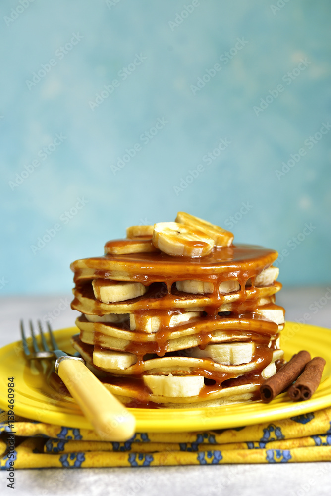 Banana pancakes with caramel for a breakfast.