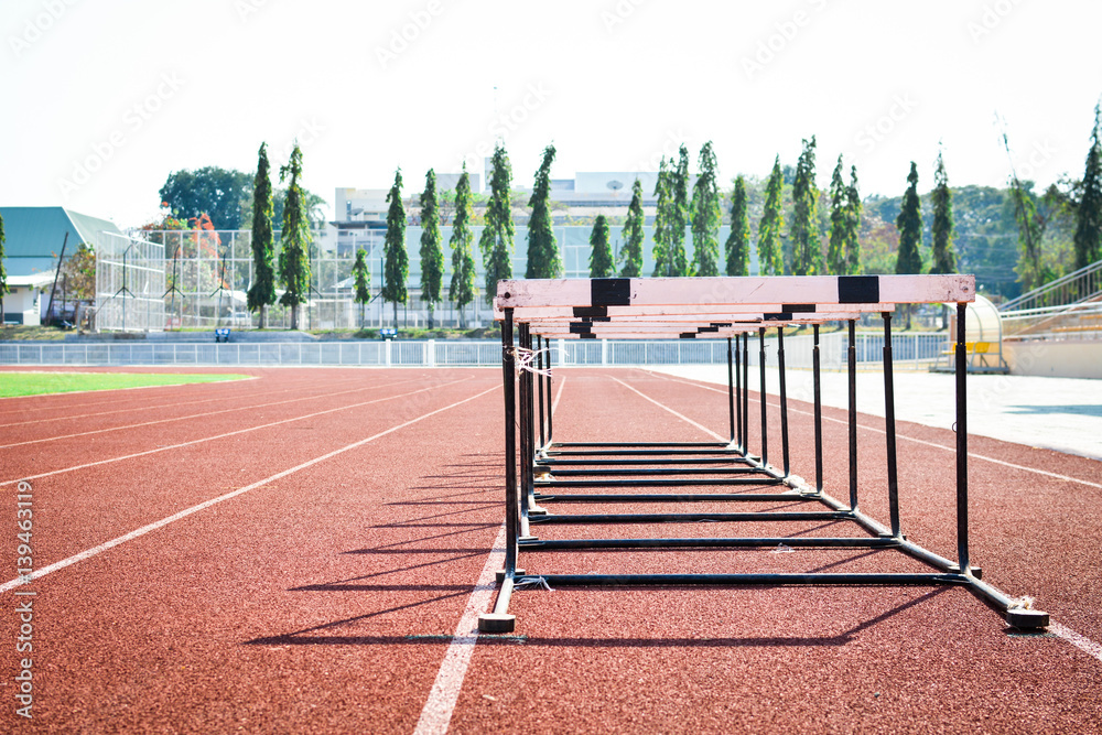 Fototapeta premium hurdle race on stadium track