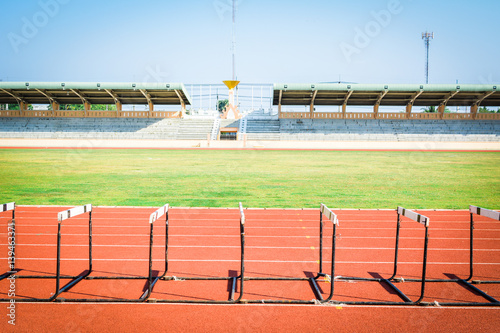 hurdle race on stadium track