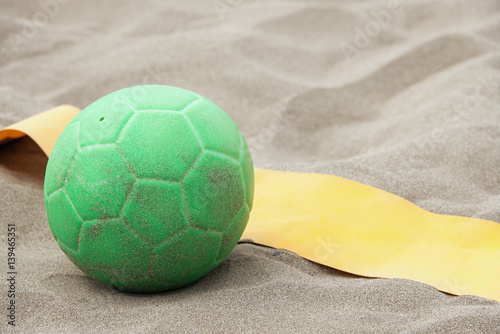 Handball ball on the beach in the sand 