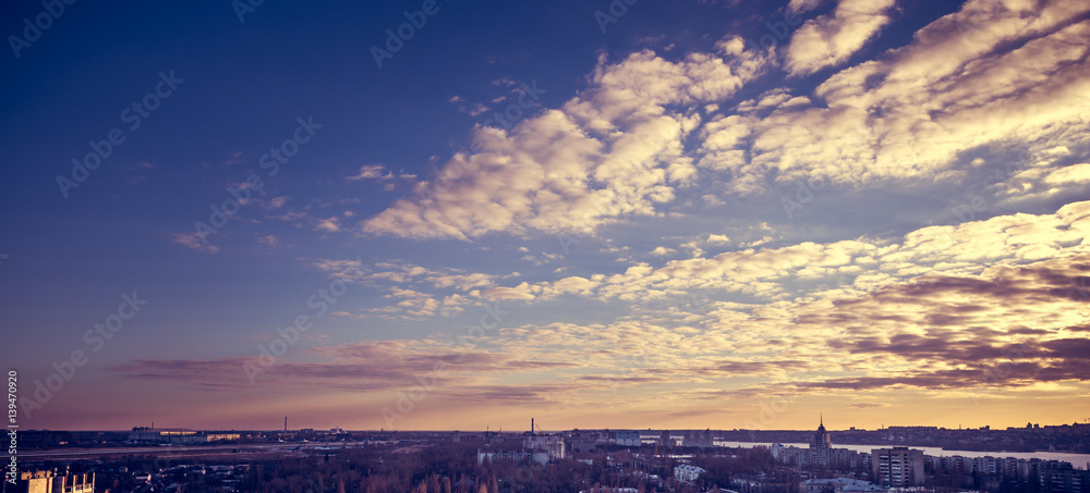 Panoramic photo of a colorful dramatic sunset in purple tones on Voronezh