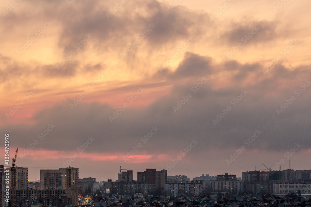 Dramatic aerial sunset cityscape from rooftop of Voronezh city with houses Dramatic aerial sunset cityscape from rooftop of Voronezh city with houses