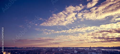 Panoramic photo of a colorful dramatic sunset in purple tones on Voronezh © DedMityay