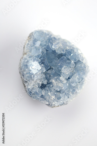 blue crystal Celestite (Celestine ) on a white blurred background