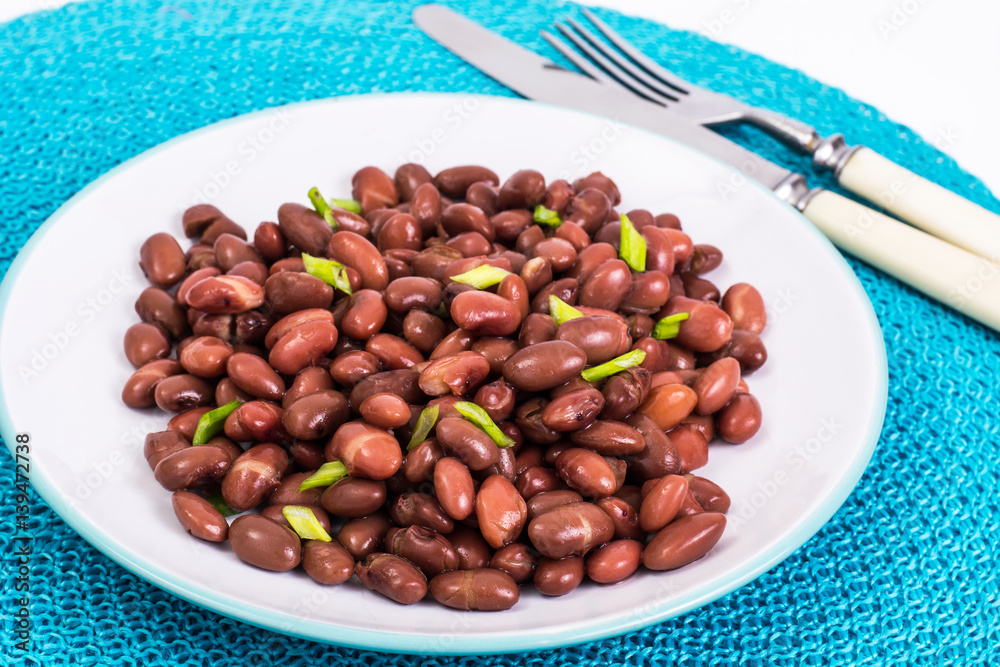 Spicy dish of red beans with green onions and spices