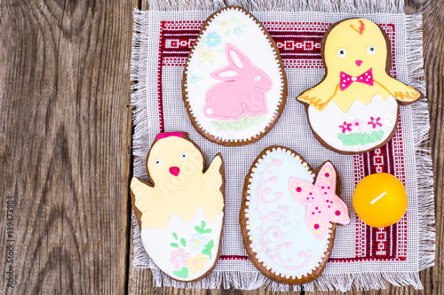 Gingerbread with Easter theme on a wooden background