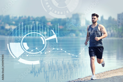Handsome man jogging on riv...