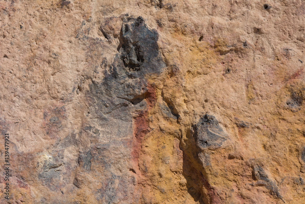 Textured surface of colorful rock Textured surface of colorful rock