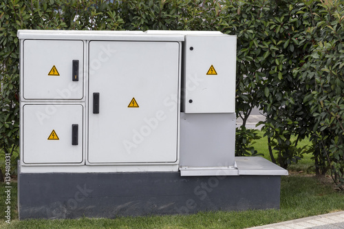 Outdoor plastic electrical cabinet with warning signs