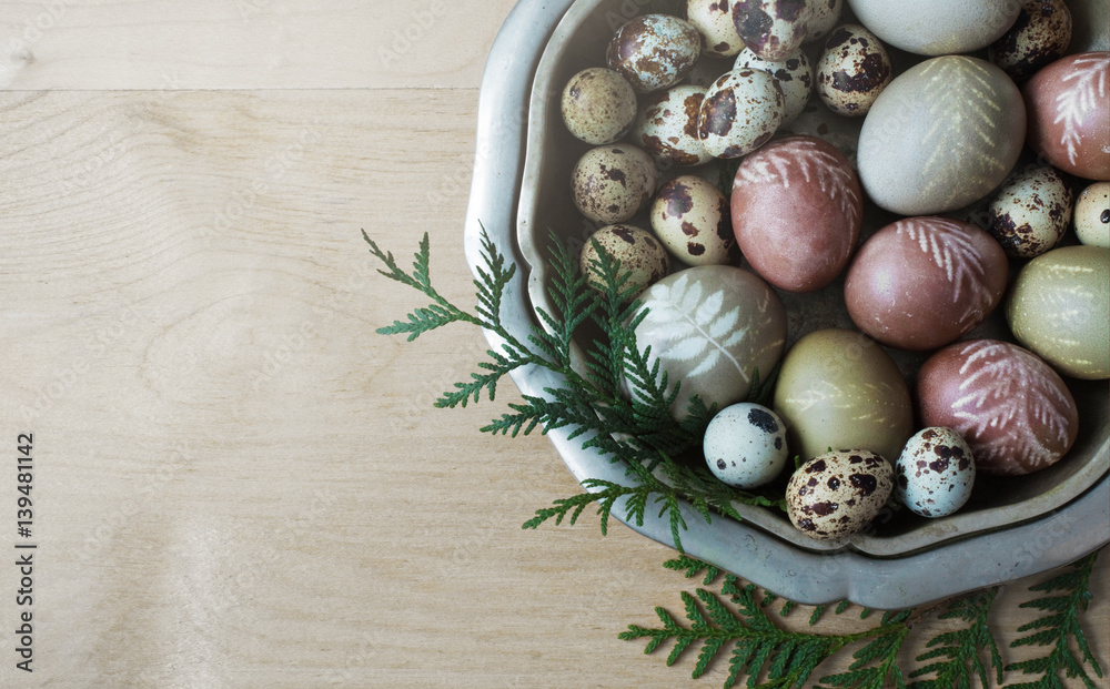 Hand-painted natural dye decorated Easter eggs in the vintage dish on a wooden background. Empty space for your promotional content. Easter concept Hand-painted natural dye decorated Easter eggs in the vintage dish on a wooden background. Empty space for your promotional content. Easter concept